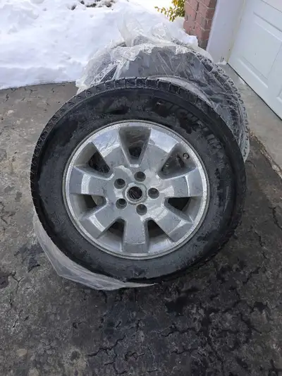 I am selling a set of four 18x7.5J Jeep alloy rims mounted with Michelin winter tires, size 245/60R1...