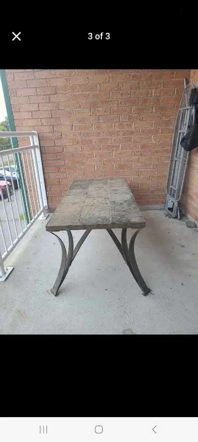 Selling an outdoor coffee table with a tile top. It's in good condition and ready for your patio or...