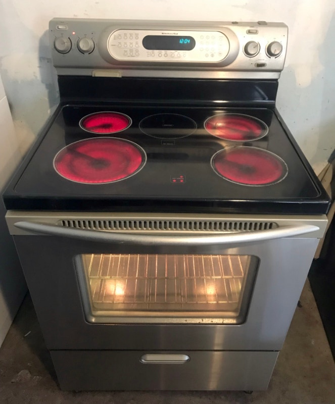 Kitchen Aid self clean n convection glass top stove, can deliver