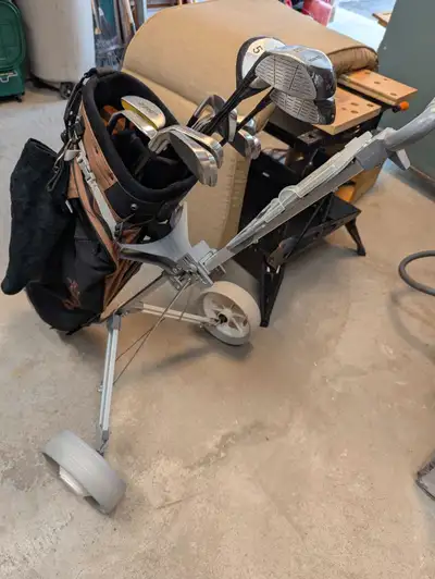 This is a used Tour Balance golf set. It includes a driver, 3 wood, 5 wood, irons, and a putter, alo...