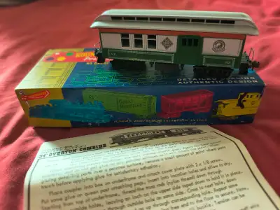 HO Overton 34' Combination car in Northern Pacific. I have painted an adobe red stripe just under th...