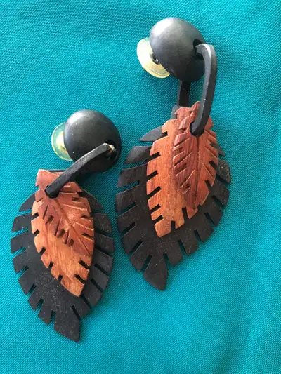 Carved wood feather design earrings , View more