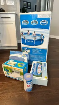 NEW INTEX Above ground pool 12ft x 30in high with accessories.