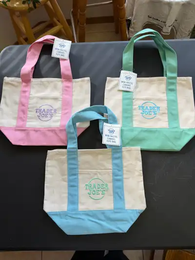 - Trader Joe’s mini totes, pink, green, or blue - New with tags - Machine washable - Stored in a pet...