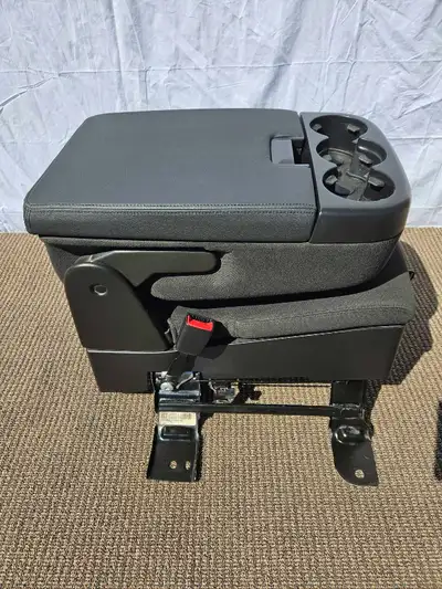Center console jumpseat that fits 1999-2014 Chevrolet and Gmc suvs dark grey fabric. Two large stora...