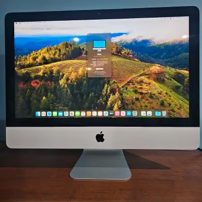2019 Apple iMac Retina 4K 21.5-inch desktop computer, featuring a 3 GHz 6-Core Intel Core i5 process...