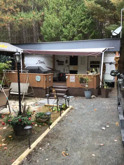 2007 Zinger 32’ at South Bay Park. Also 10x10 bunkie and 12x12 gazebo. Extra fridge, table and chair...