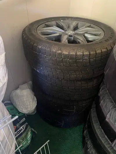 Genuine VW OEM 18” alloy wheels with Toyo Observe RX826 winter tires, 235/55R18. Tires are basically...