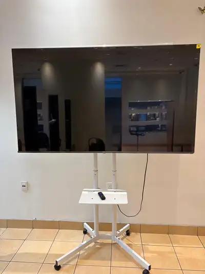 Barely used as good as new tv with stand and remote