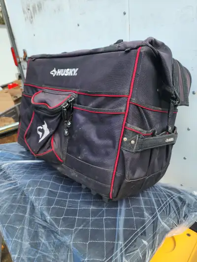 For sale a Husky Big Canvas Heavy Duty Tool Bag On Wheels With Retractable Handle. The measurements,...