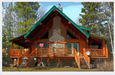 Escape to this beautiful 5 bedroom rural log home, perfectly maintained and ready for your summer ge...