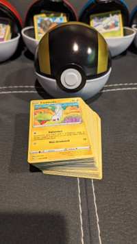 Pokémon card lot in Pokéball tins