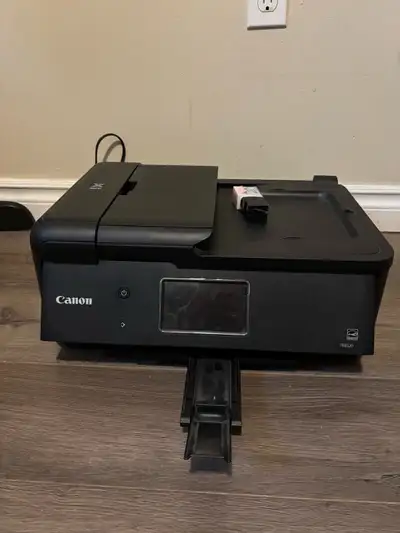 Gently used printer. Some ink still in it and an additional new black ink.