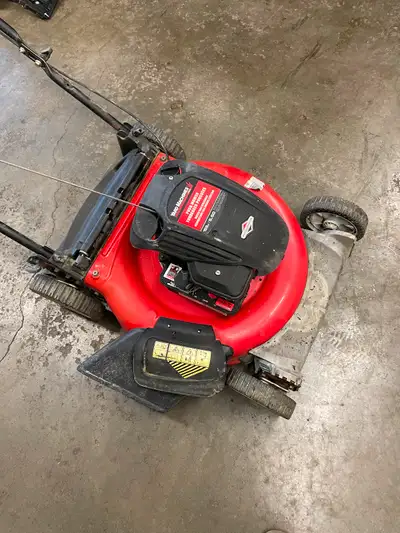 Yard Machines 5.5hp gas lawnmower starts and runs great no bag. $80 firm