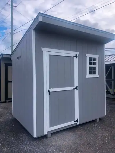 6x8 Compact Utility Shed with exposed studs on the interior to customize your shed organization! Wit...