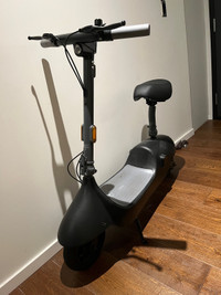 Seated electric scooter