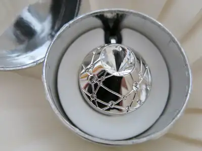 From a pet and smoke free home. For sale a SWAROVSKI CRYSTAL TOUCH MAKE-UP JEWEL / LOCKET. This lock...