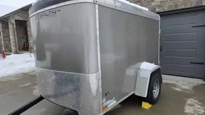 I'm selling a used Stealth Cargo Trailer. This enclosed trailer is perfect for hauling equipment, fu...