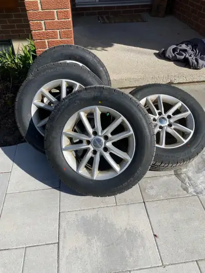 New BF Goodridge All season tires (225 65 R17). Rims are used but in good condition. Drove on a Dodg...