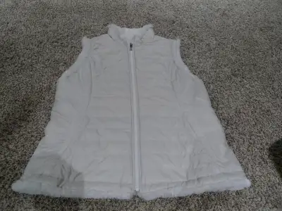 White puffy vest - Size XL. Slightly off white exterior with white fur trim/interior. Very soft mate...