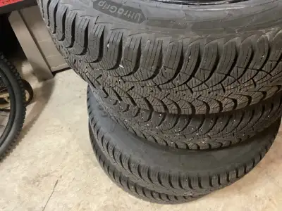 Selling set of snow tires and rims , size 205/ 60/ 16