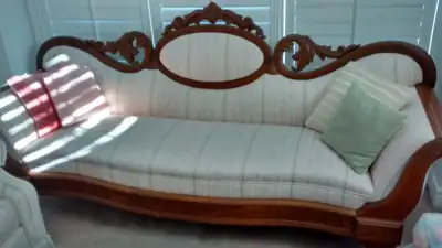 Beautiful victorian antique camel back settee/couch for sale. It is from 1900, believed to be black...