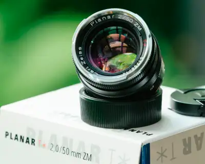Bought new and used infrequently, this Zeiss Planar T* 2 50 ZM is in excellent condition and functio...