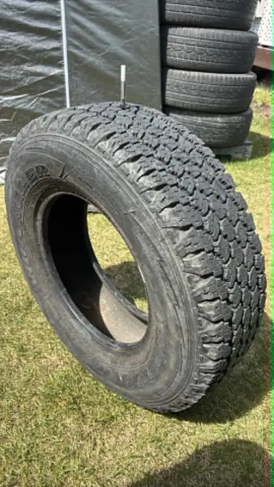GOODYEAR WRANGLER ALL TERRAINE ADVENTURE LT245/75 R16 120/116S M+S LOAD RANGE E 90% left tread 1 tir...