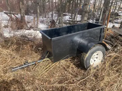 This is a used trailer, perfect for hauling wood or supplies. It's in good condition and ready for w...