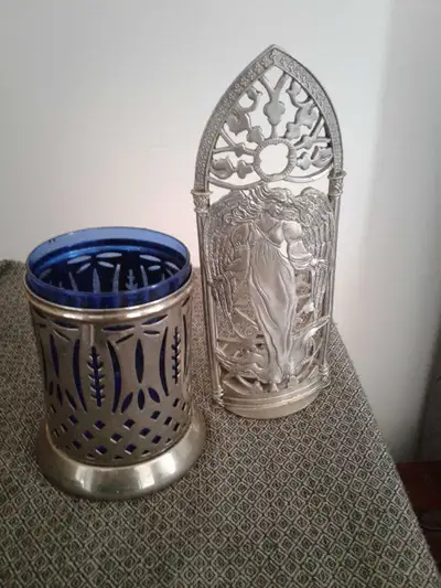 Pewter and silver plated tea lite candle holders., View more