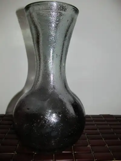 Thick glass flower vase made in Spain., View more
