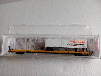 New in box Micro Trains car with Micro Trains trailer load. If ad is up it's available.