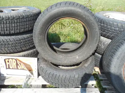 1 studded 215-75-R 15 0n 5 stud wheel. $ 20.00