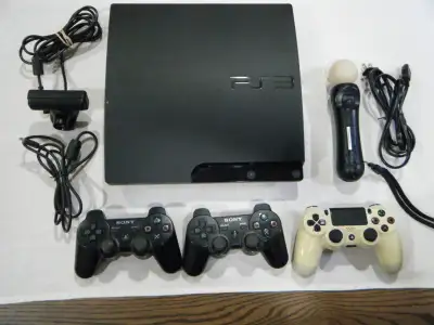 Playstation 3 Console, 2 PS3 controllers, 1 move motion controller, 1 camera, 1 PS4 controller. Play...
