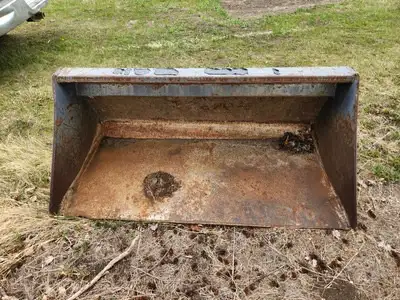 Located 20 mins south of Calgary near Saskatoon Tree Farm Skid Steer 65” bucket