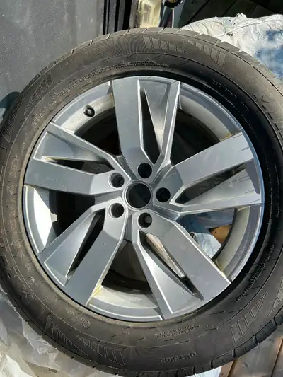 Original VW atlas rims with all season tires. One tire has a puncture.