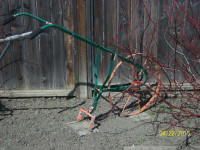 Antique walk behind push garden cultivator