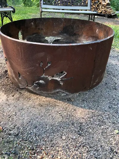 Large solid firepit. Cutouts of birds and leaves. Super heavy
