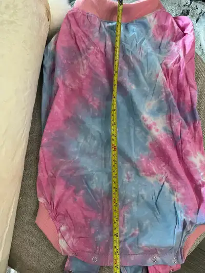 Brand new dog outfit. About 20” long, and 12-13” wide.