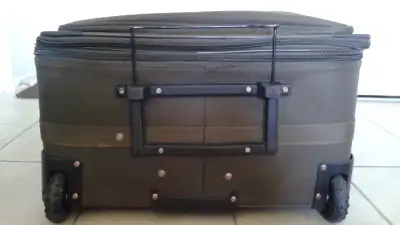 A Canadian Tourist brand new, never used extra large size suitcase for sale for $ 100 firm. This sui...