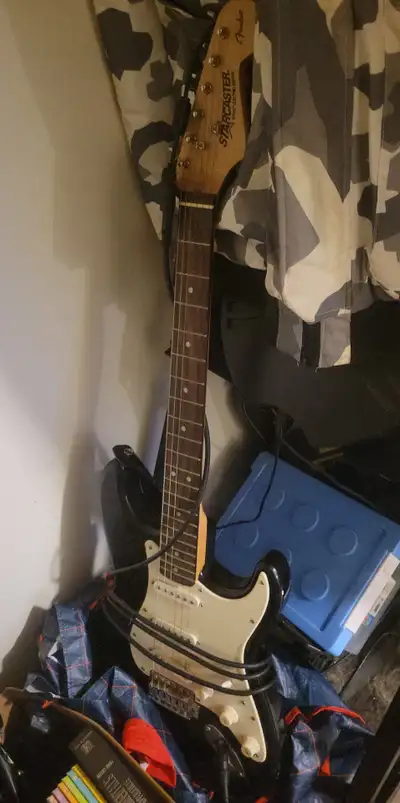$150 StarCaster Black and White Electric Guitar, View more