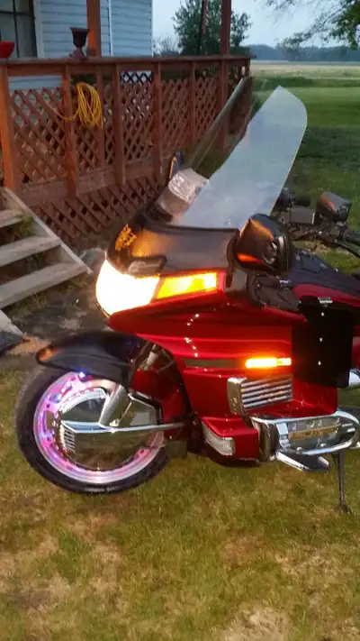 This is a used 1995 Honda Goldwing, a touring motorcycle known for its comfort and reliability, comp...