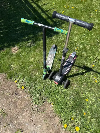Two Scooters for sale. $20 for both. One is a YBike with three wheels and the other is a regular two...