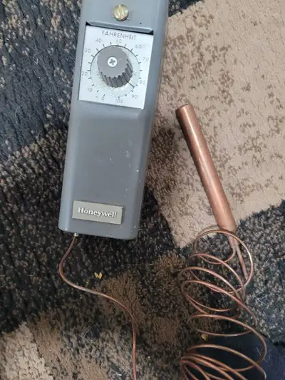 Honeywell. Not sure what it's worth. Prices seem to vary. My father worked in commercial buildings ....