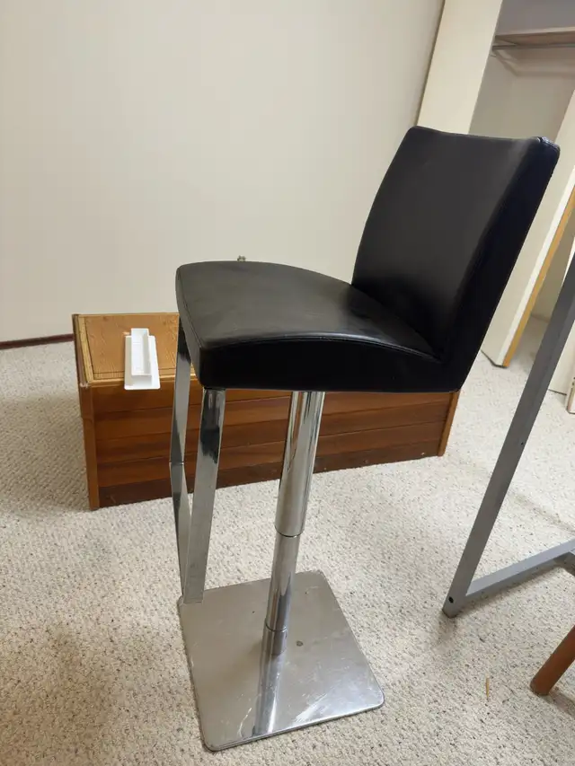 Two adjustable barstools417524279547668480