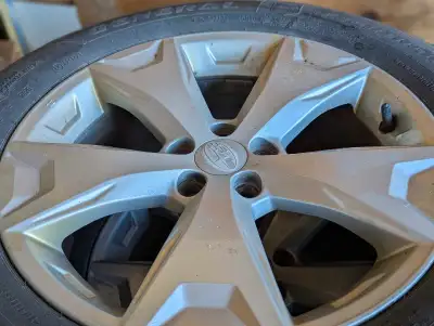 Subaru rims with General all season tires, sized at 225/60R17, 5 bolt pattern. Lots of tread left on...