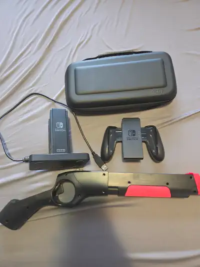 I'm selling a set of Nintendo Switch accessories. This includes: - Game Gun controller - Joy-Con cha...
