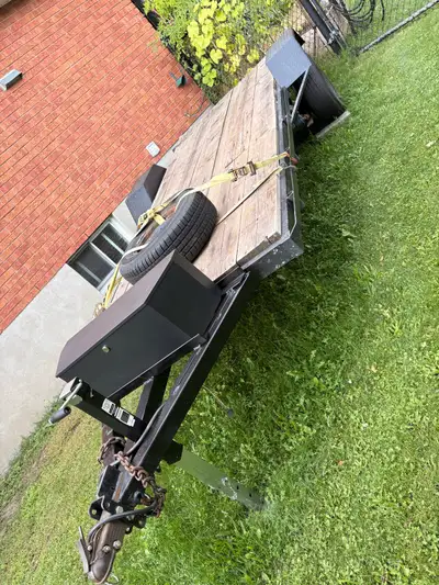This sturdy flatbed utility trailer is ready for your next project, featuring a durable steel frame...