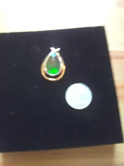 I have a teardrop pendant from Alberta's own provincial gemstone Ammolite , two tone, approx 18x11 m...