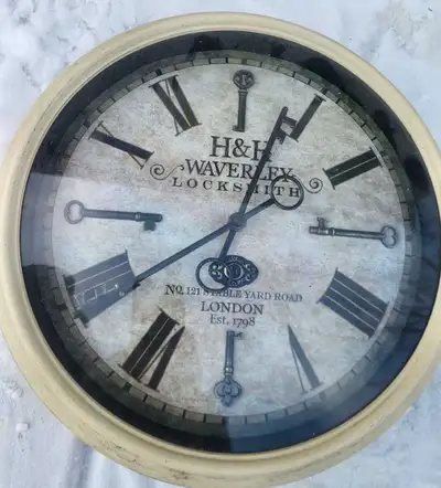 Add a touch of vintage charm to your home with this H&H Waverley Locksmith wall clock! This used clo...